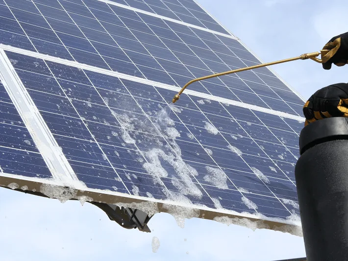 Soiling being washed from the face of a solar module